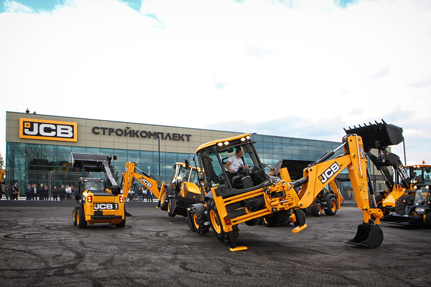 The JCB Dancing Diggers take a bow at the official opening of the world's biggest JCB dealer depot in Russia